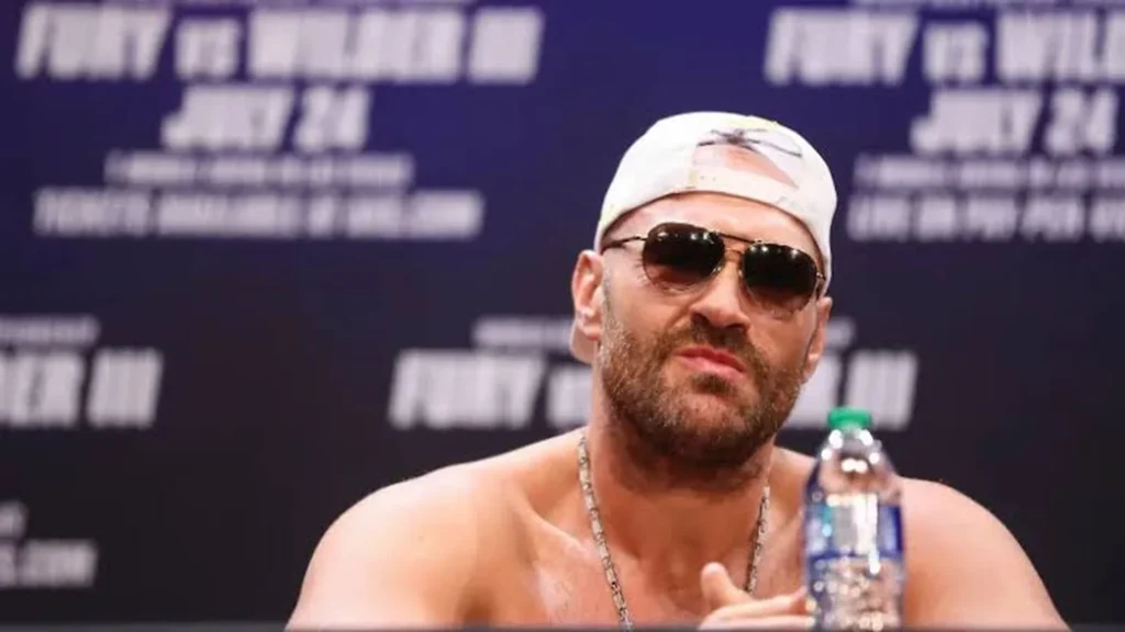 Tyson Fury net worth boxer at a heavyweight title press conference